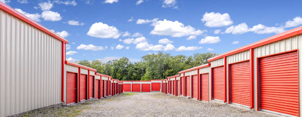 Home Staging and Storage Solutions for Athens, Texas Homeowners Athens homeowner organizing furniture in a storage unit while preparing home for sale.